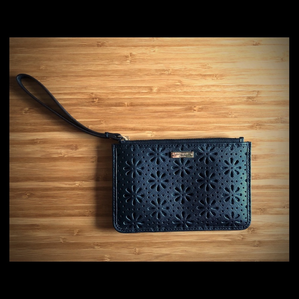 Kate Spade faux leather flower lace wristlet.